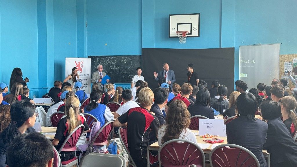 Closing presentations at The King John School with the Design for Life board visible.